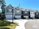 Townhouse exterior, featuring a gray exterior and two-car garage at 2559 Oakbourne Ln, Smyrna, GA 30080