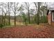 Spacious backyard with a view of the lake and trees at 340 Sir Richard Ct, Jonesboro, GA 30236