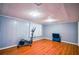 Finished basement with elliptical and wood floors at 340 Sir Richard Ct, Jonesboro, GA 30236