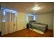 Bright bedroom featuring wood floors and sheer curtains at 340 Sir Richard Ct, Jonesboro, GA 30236