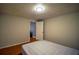 Simple bedroom with wood floors and an ensuite bathroom at 340 Sir Richard Ct, Jonesboro, GA 30236