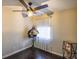 Small bedroom with hardwood floors and ceiling fan at 340 Sir Richard Ct, Jonesboro, GA 30236