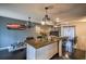Modern kitchen with granite island and dark hardwood floors at 340 Sir Richard Ct, Jonesboro, GA 30236