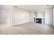 Spacious living room with fireplace and neutral carpet at 6674 Eastbriar Dr, Lithonia, GA 30058