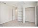 Bright bedroom featuring built-in shelving and closet at 6674 Eastbriar Dr, Lithonia, GA 30058