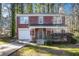 Brick home with attached garage and landscaping at 6674 Eastbriar Dr, Lithonia, GA 30058