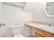 Clean bathroom with sink, toilet, and vanity at 6674 Eastbriar Dr, Lithonia, GA 30058
