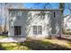 Rear view of the house with patio and landscaping at 6674 Eastbriar Dr, Lithonia, GA 30058