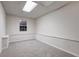 Basement room with carpet, window, and wainscoting at 76 Cedars Glen Cir, Villa Rica, GA 30180