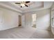 Large main bedroom with tray ceiling and plush carpeting at 76 Cedars Glen Cir, Villa Rica, GA 30180