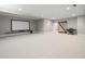 Finished basement with home theater, carpeted floors and barn door at 230 Pebble Trl, Alpharetta, GA 30009