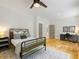 Charming bedroom with metal bed frame and wood floors at 230 Pebble Trl, Alpharetta, GA 30009