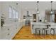 Modern kitchen featuring white cabinets and marble counters at 230 Pebble Trl, Alpharetta, GA 30009