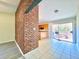 Dining area with brick accent wall and kitchen view at 650 Lyric Nw Way, Atlanta, GA 30318
