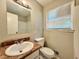 Clean bathroom with single sink vanity and shower/tub combo at 650 Lyric Nw Way, Atlanta, GA 30318