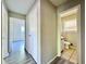 Hallway with wood-look flooring and access to bedrooms and bath at 650 Lyric Nw Way, Atlanta, GA 30318