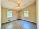 Well-lit bedroom with ceiling fan and wood-look flooring at 650 Lyric Nw Way, Atlanta, GA 30318