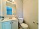 Small bathroom with white vanity and toilet at 650 Lyric Nw Way, Atlanta, GA 30318