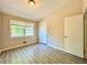 Bright bedroom with double windows and wood-look flooring at 650 Lyric Nw Way, Atlanta, GA 30318