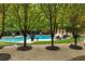 Relaxing pool area nestled among trees, featuring comfortable seating at 4665 Riverview Rd, Atlanta, GA 30327