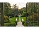 Landscaped backyard with a pool and gazebo at 4665 Riverview Rd, Atlanta, GA 30327