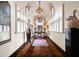 Elegant hallway with hardwood floors, beautiful artwork, and natural light at 4665 Riverview Rd, Atlanta, GA 30327