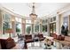 Sunroom with ample seating, large windows, and stunning views at 4665 Riverview Rd, Atlanta, GA 30327