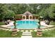 Circular pool surrounded by lush landscaping and comfortable seating at 4665 Riverview Rd, Atlanta, GA 30327