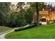 Elegant home with a covered drive and manicured lawns at 4665 Riverview Rd, Atlanta, GA 30327