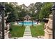 Inviting pool with surrounding patio and lush landscaping at 4665 Riverview Rd, Atlanta, GA 30327