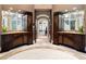 Double vanity bathroom with custom cabinetry and marble flooring at 4665 Riverview Rd, Atlanta, GA 30327