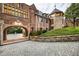 Brick home with a charming archway entrance and a large backyard at 4665 Riverview Rd, Atlanta, GA 30327