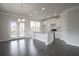 Modern kitchen with white cabinets, granite island, and access to deck at 577 Fundao Ln # 14, Lawrenceville, GA 30046