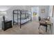 Bedroom with bunk beds, a desk, and a nightstand at 11638 Chatham Dr, Hampton, GA 30228