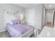 Charming bedroom with purple bedding and a desk at 11638 Chatham Dr, Hampton, GA 30228