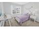 Well-lit bedroom with a desk and a white bed frame at 11638 Chatham Dr, Hampton, GA 30228
