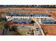 Aerial view of new townhouses with attached garages and playground at 11638 Chatham Dr, Hampton, GA 30228