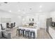 Open kitchen with island, granite countertops, and stainless steel appliances at 11638 Chatham Dr, Hampton, GA 30228