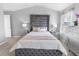 Main bedroom with plush bed and elegant decor at 11638 Chatham Dr, Hampton, GA 30228