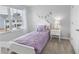 Bright bedroom with a white bed frame and window at 11638 Chatham Dr, Hampton, GA 30228