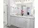 Double vanity bathroom with granite countertop at 11638 Chatham Dr, Hampton, GA 30228