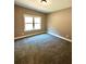 Spacious bedroom with carpet and large window at 22 Stratford Way, Kingston, GA 30145