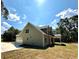 Two-story house with gray siding, stone accents, and a covered patio at 22 Stratford Way, Kingston, GA 30145