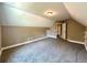 Large bedroom with carpet flooring and access to hallway at 22 Stratford Way, Kingston, GA 30145