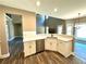 Modern kitchen with white cabinets and a large island at 22 Stratford Way, Kingston, GA 30145