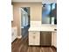Modern kitchen with white cabinets, island, and stainless steel dishwasher at 22 Stratford Way, Kingston, GA 30145