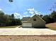 Two-story house with gray siding, stone accents, and an attached garage at 22 Stratford Way, Kingston, GA 30145
