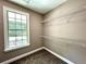 Spacious walk-in closet with wire shelving and a window at 22 Stratford Way, Kingston, GA 30145