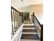 Upstairs hall with carpeted floor and railing at 22 Stratford Way, Kingston, GA 30145