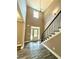 Two-story entryway with hardwood floors and a chandelier at 22 Stratford Way, Kingston, GA 30145